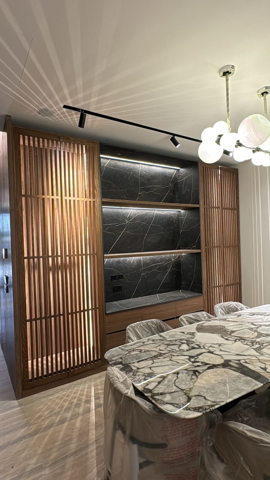 Mohammad Al Habib villa living wall — marble & timber joinery