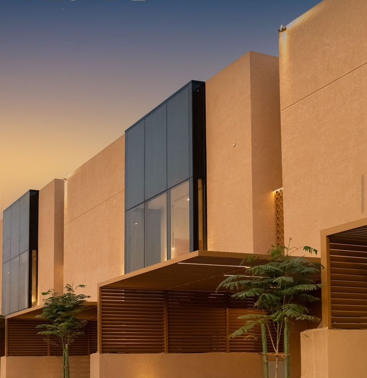 Al Habib villa facade at dusk with slatted timber canopies