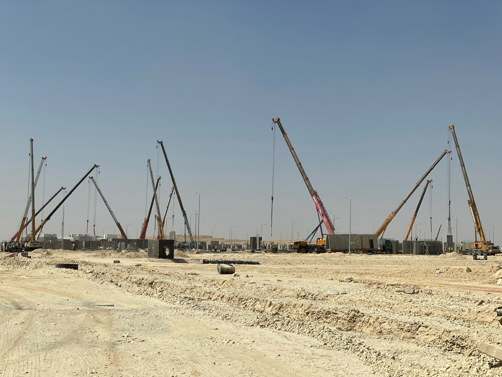Wide-angle crane fleet across the housing site