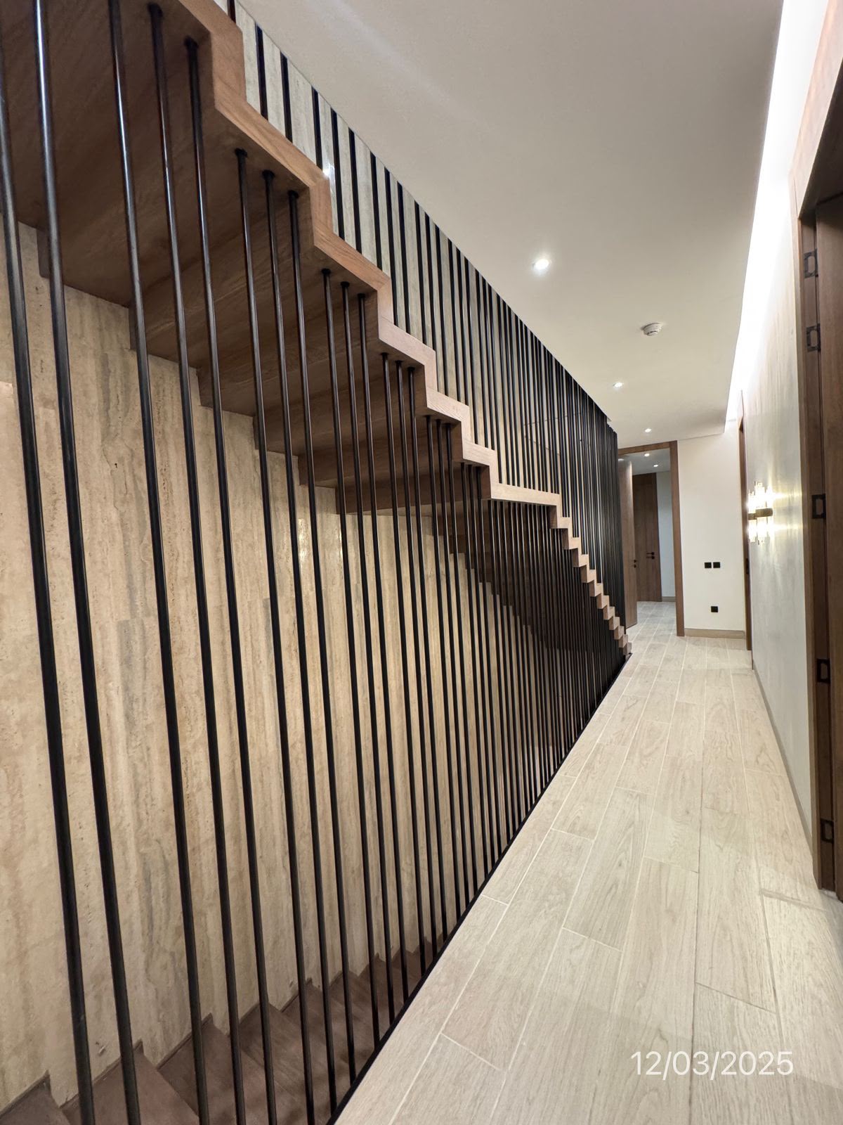 Azure villa signature stair with vertical black rails