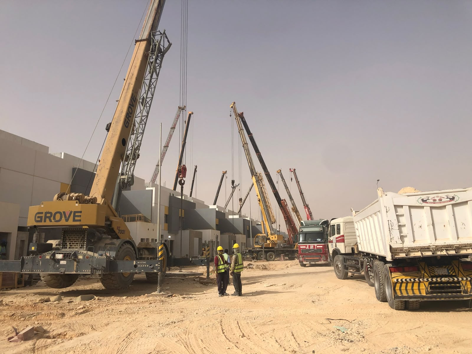 Grove crane and precast delivery convoy on site