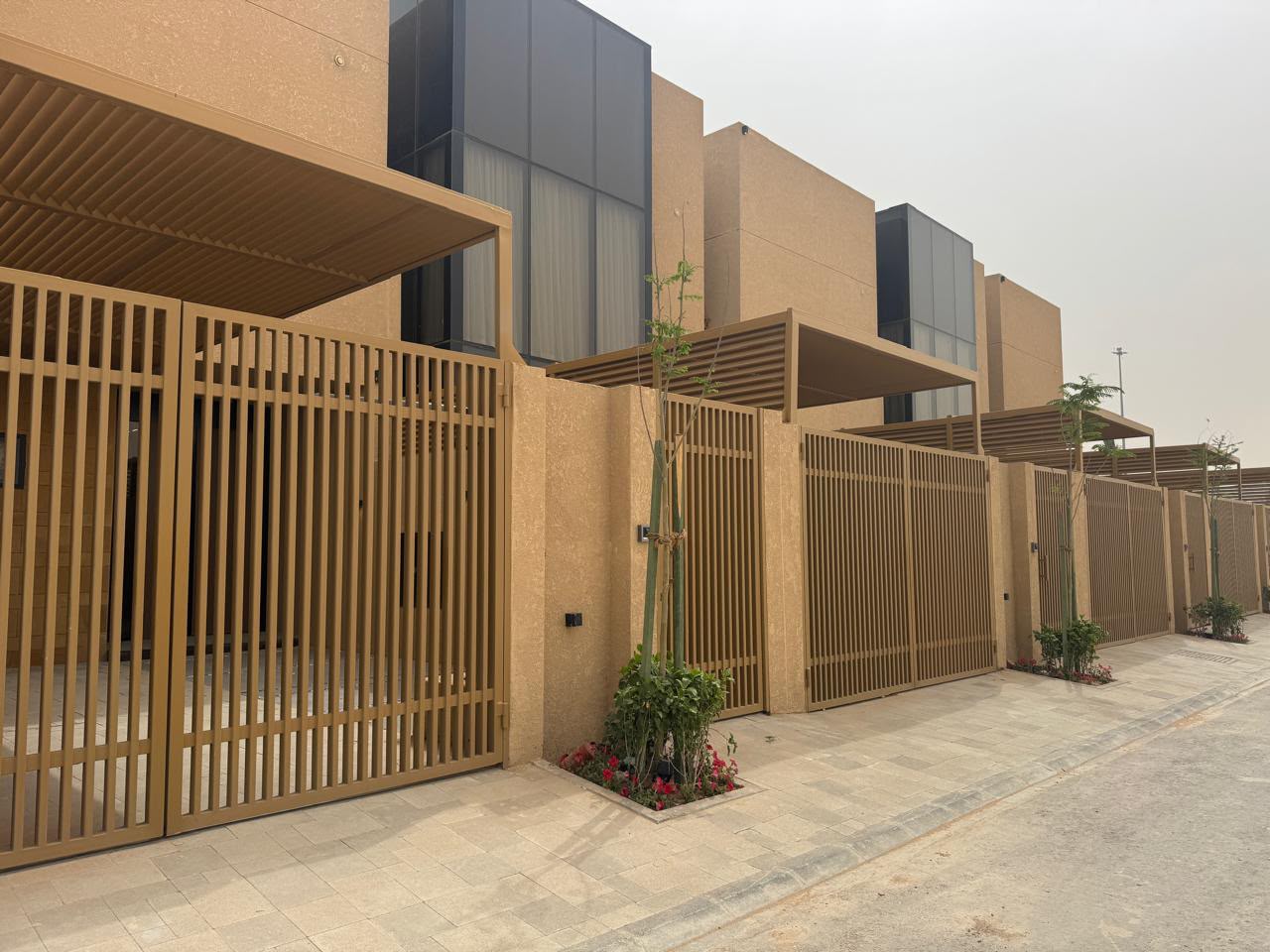 Mohammad Al Habib compound streetscape with slatted gates